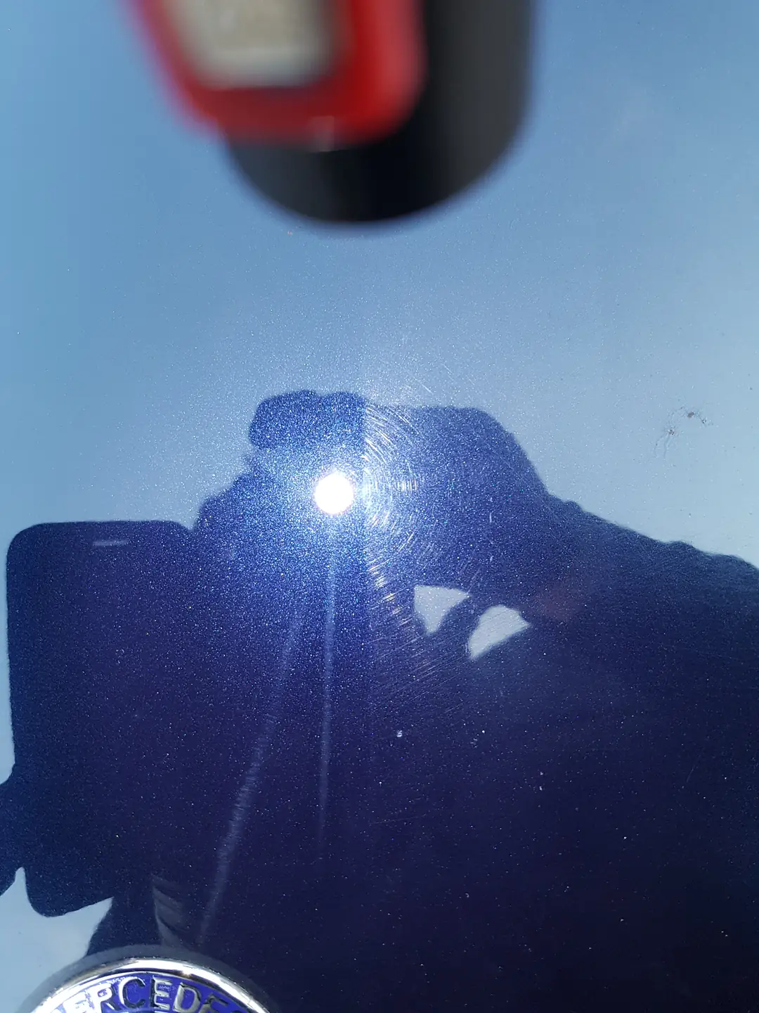 Swirl-free dark blue paint under a light
